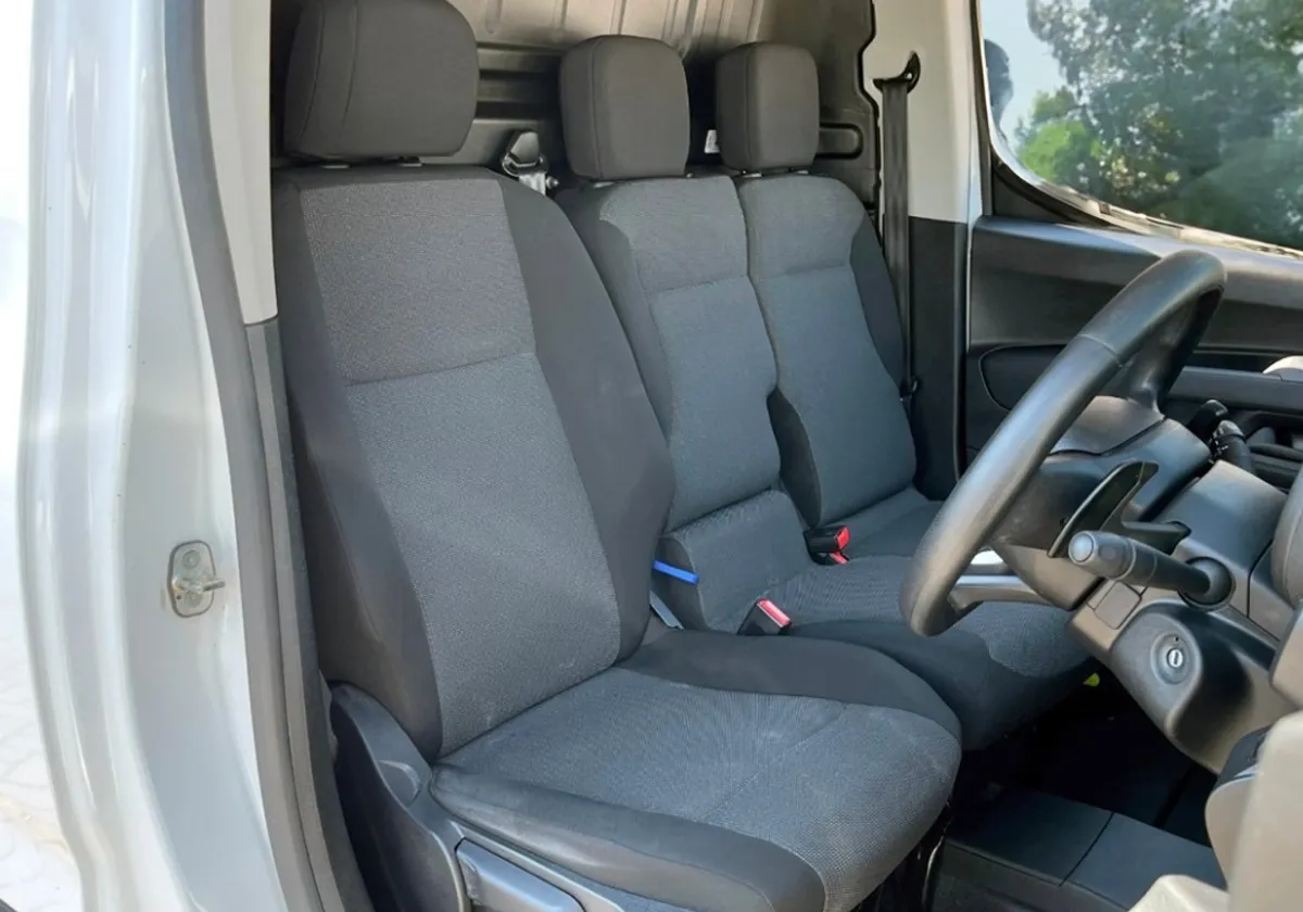 the interior of a Citroen Berlingo with gray seats.