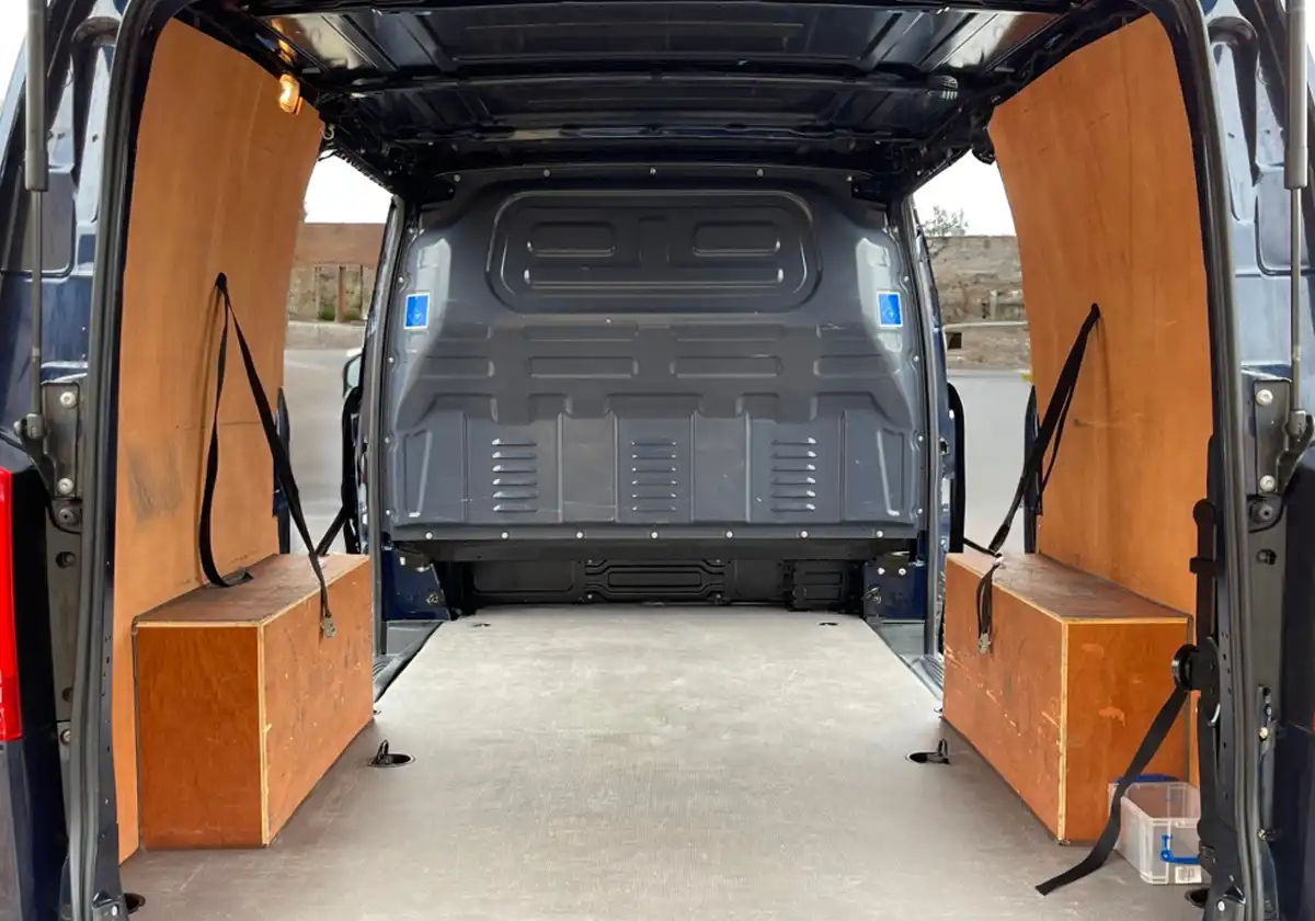 the back of a Mercedes Vito with wooden storage compartments.