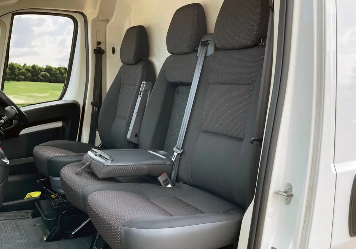 the interior of a Citroen Relay with black leather seats.