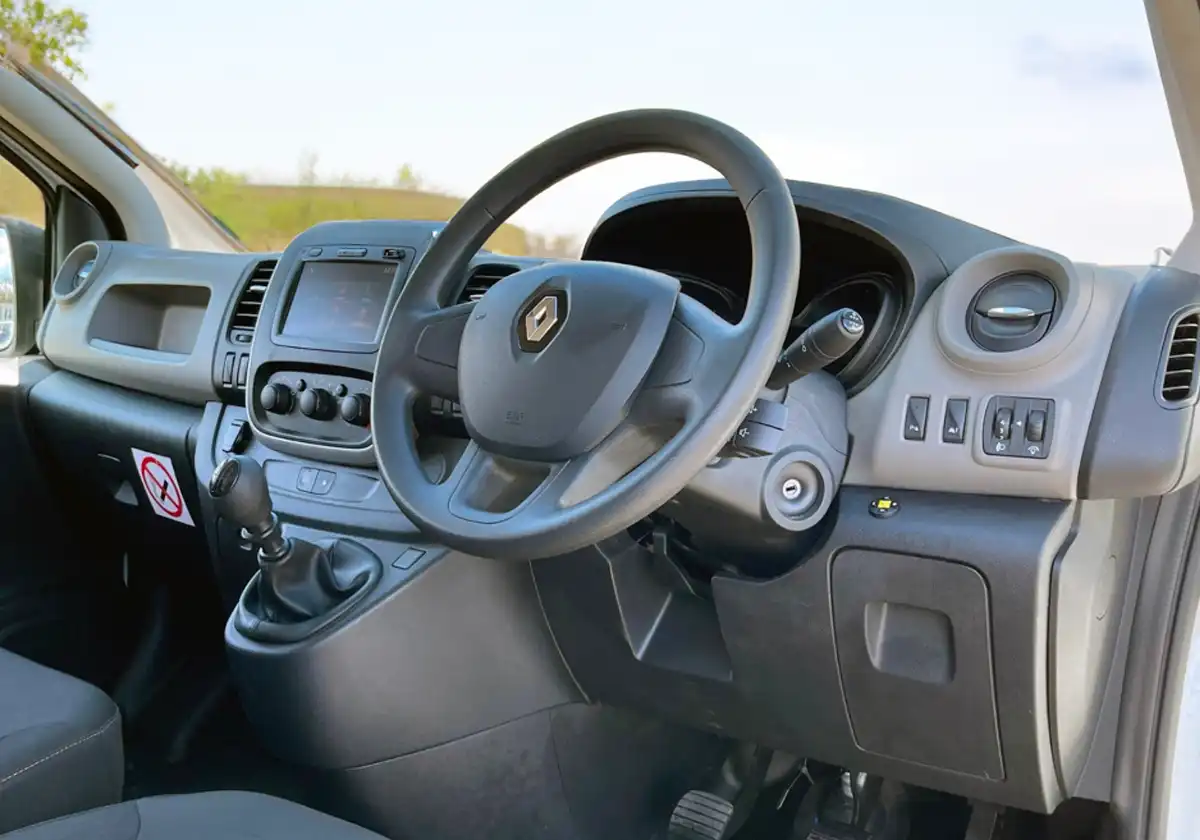 the interior of a Renault-Trafic with a steering wheel and dashboard.