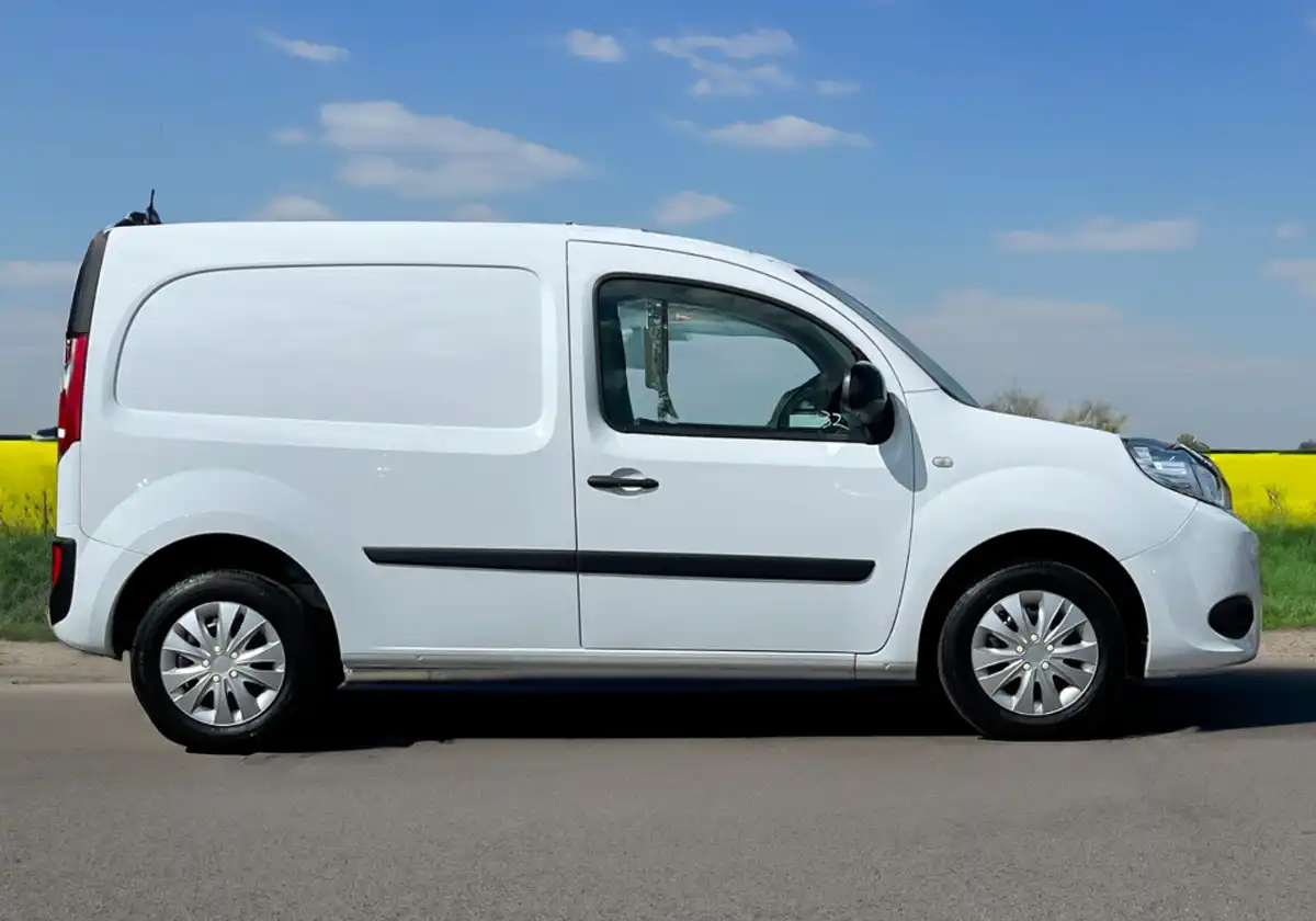 a white Renault Kangoo parked on the side of a road.