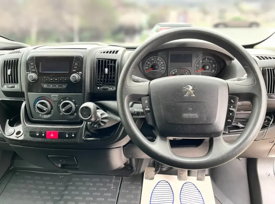 the dashboard and steering wheel of a Peugeot Boxer Low Loader .