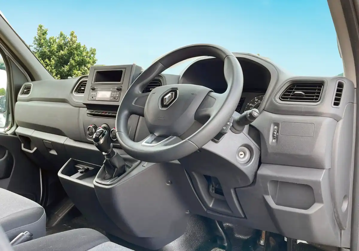 the interior of a Renault Master with a steering wheel and dashboard.