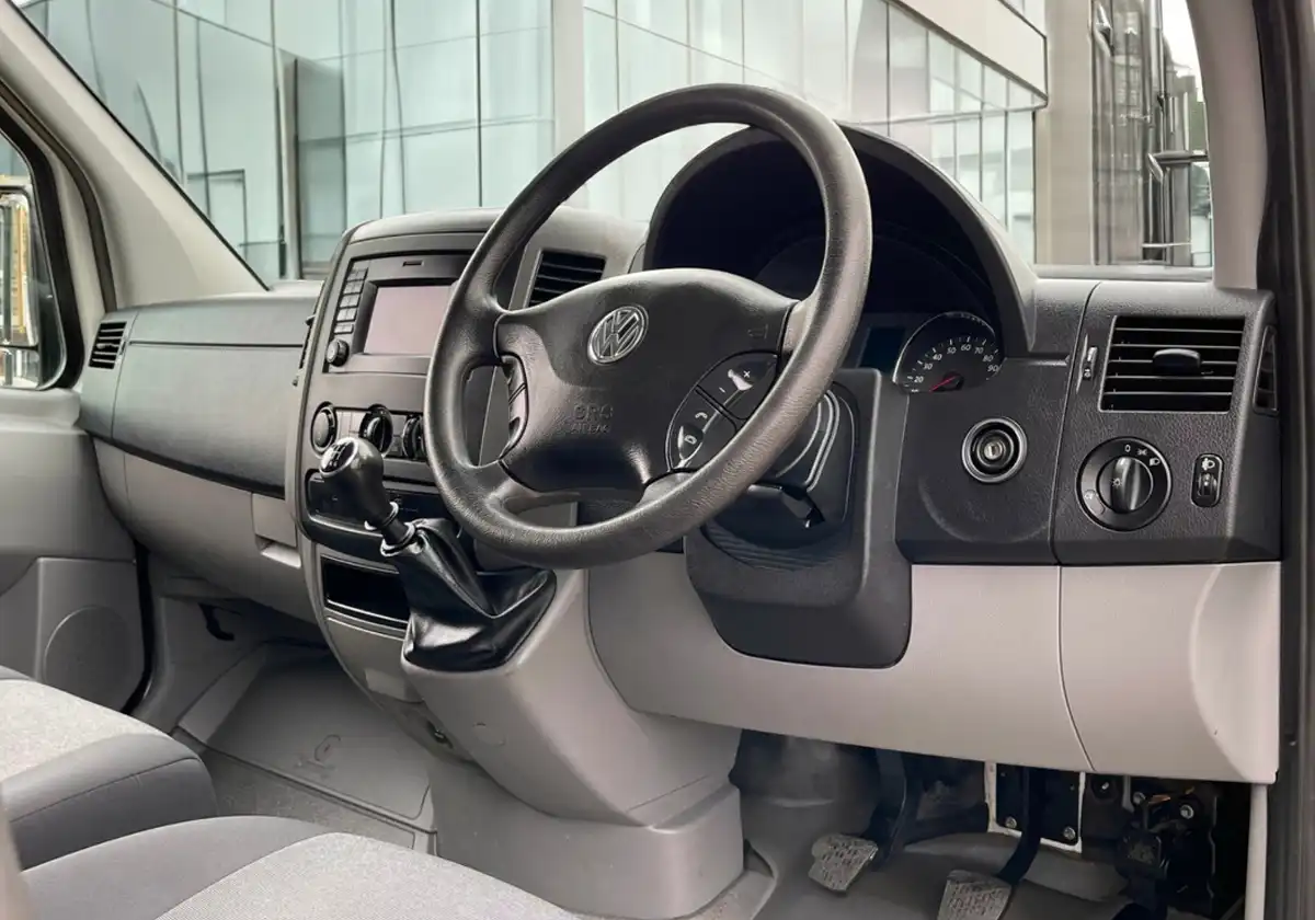 The dashboard and steering wheel of a Volkswagen Crafter Dropside