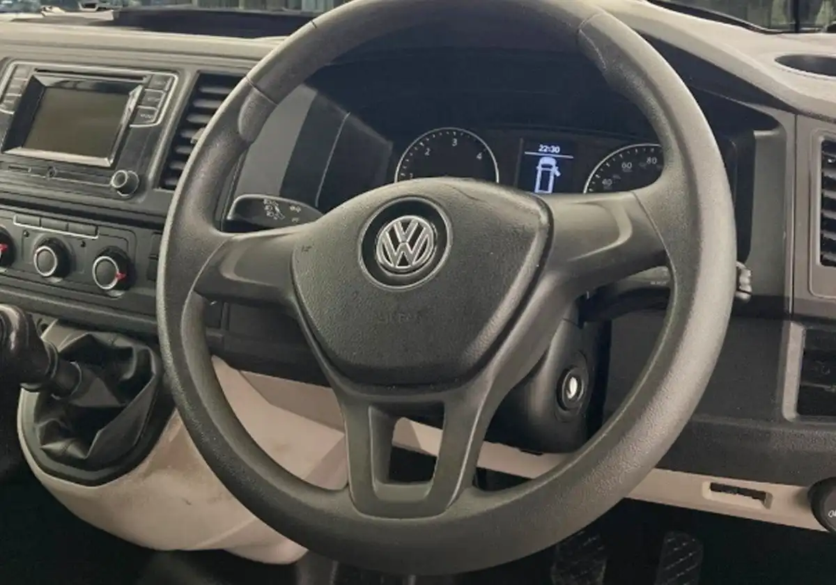 the dashboard and steering wheel of a Volkswagen-Transporter.